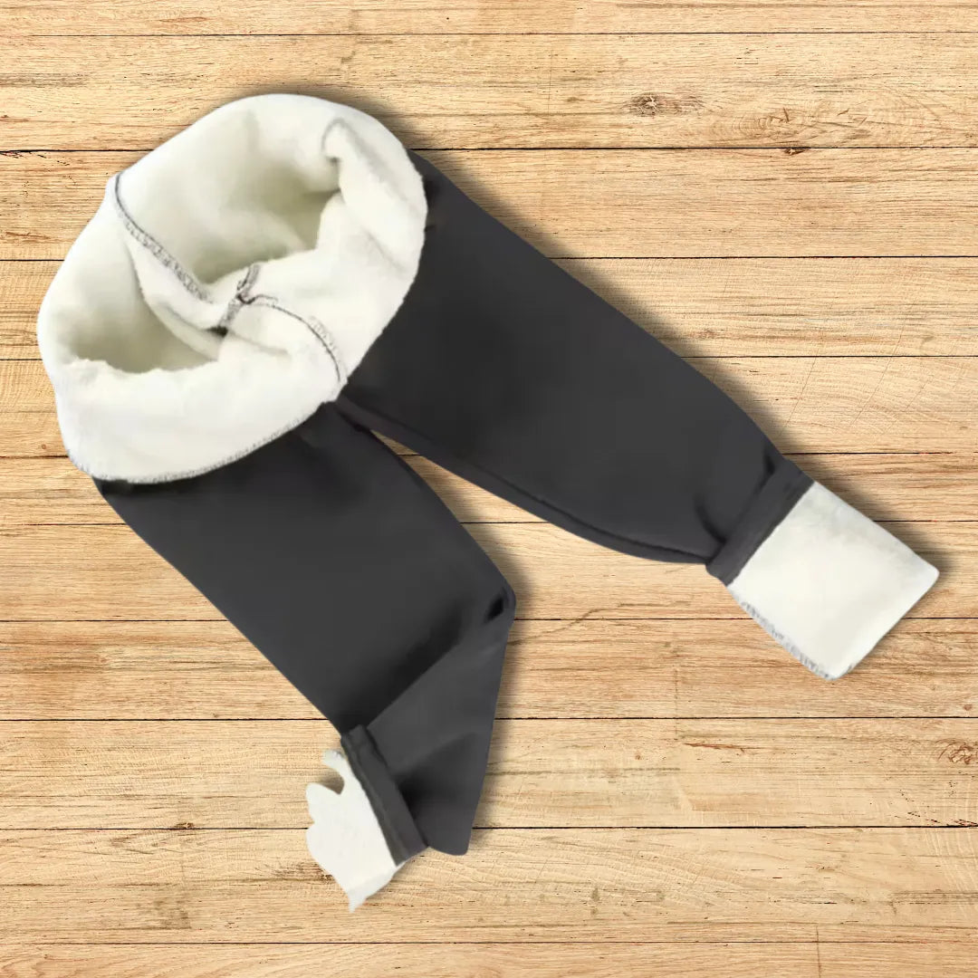 Legging de inverno feminina dobrada sobre superfície mostrando o forro térmico